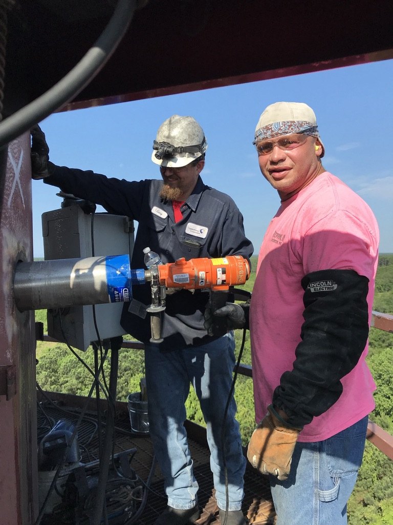 McPherson Specialty Welding crew on-site up a tower